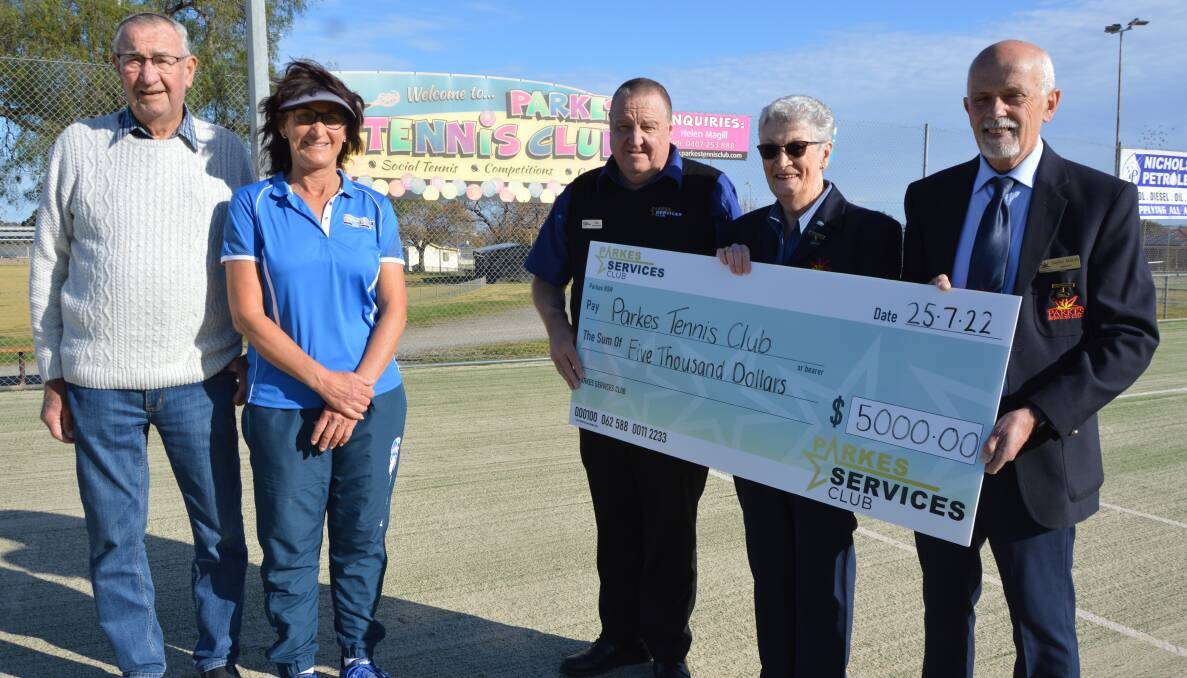 Hedley Nicholson OAM and Helen Magill from the Parkes Tennis Club were grateful to receive $5000 in sponsorship from Parkes Services Club general manager Mike Phillips, president Dorothy Charlton and vice president Stefan Mikita. Picture by Christine Little
