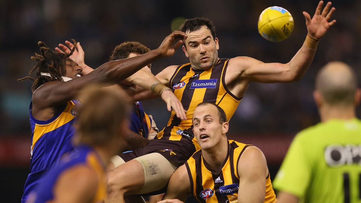 Jordan Lewis attempts to mark under pressure from several players. Photo: Getty Images.