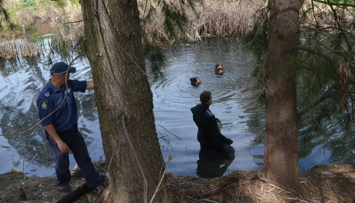 SEARCH: Police divers combed Burrangong Creek last Saturday looking for evidence to assist the Corey Power murder investigation.