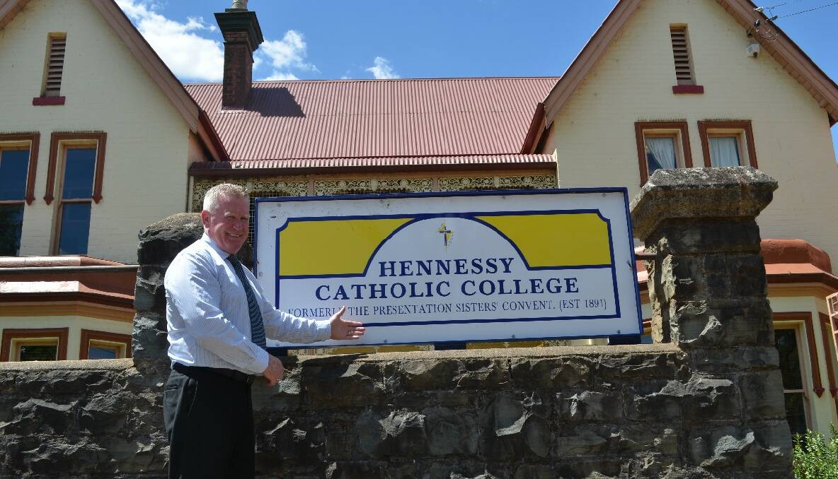 THRILLED: Hennessy Catholic College principal Dr Peter Webster outside the school last week.